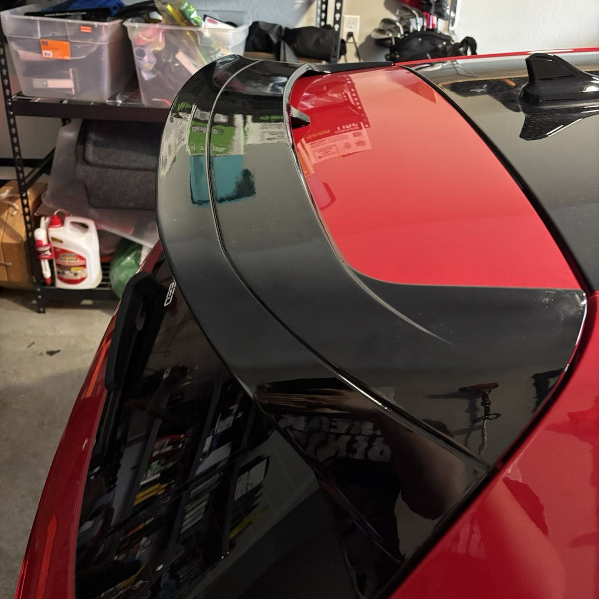 Golf 8 GTI R gloss black rear roof spoiler installed on red car