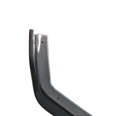 Infiniti Q50 Sport carbon fiber front lip side section close-up showing 3K weave finish and pre-drilled mounting holes
