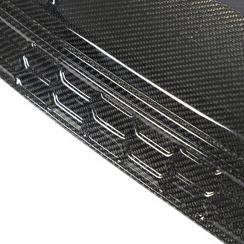 Gloss carbon fiber weave and lower trim detail on the Audi A3 S Line S3 8Y rear diffuser