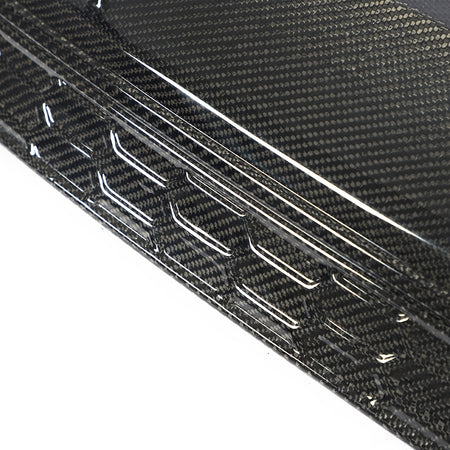 Gloss carbon fiber weave and lower trim detail on the Audi A3 S Line S3 8Y rear diffuser