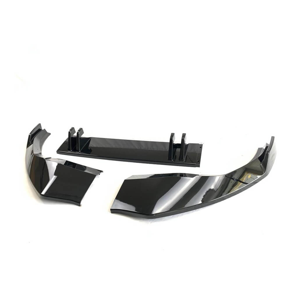Audi Q8 gloss black front splitter with center vertical fins detail