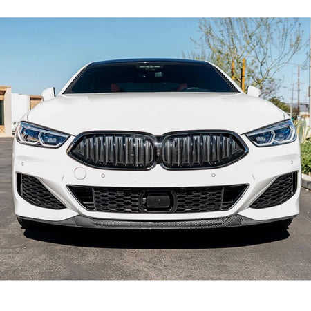 Front fitment view of the carbon fiber front lip on a BMW 8 Series M Sport bumper