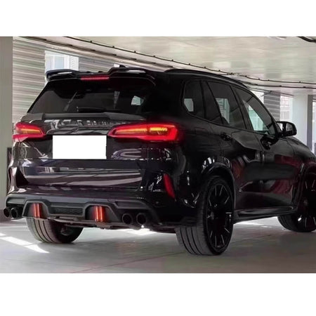 BMW F95 low-profile rear trunk spoiler installed rear three-quarter view