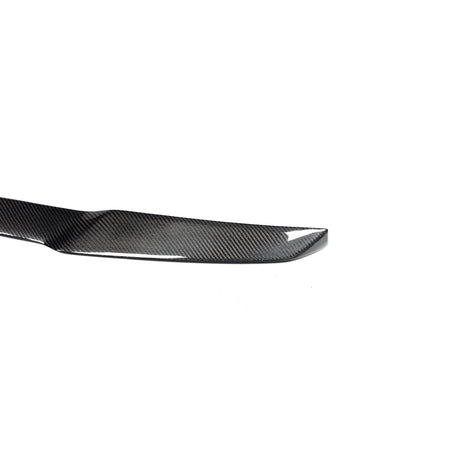 BMW X5M carbon fiber rear spoiler outer end and gloss finish detail