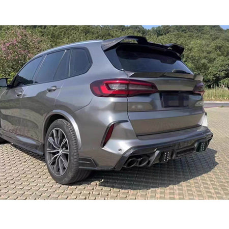 BMW X5M carbon fiber rear spoiler installed from rear side angle