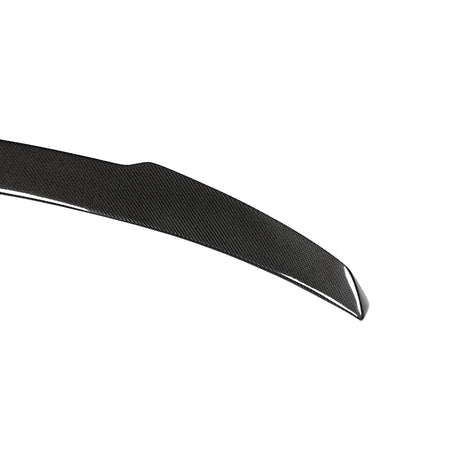BMW X5M rear trunk spoiler gloss carbon fiber weave close-up