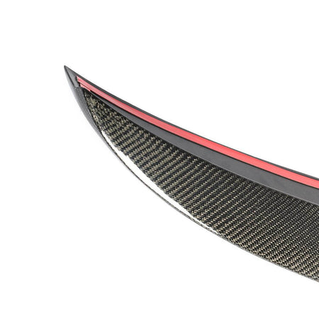 Carbon fiber trunk spoiler weave and adhesive mounting edge detail