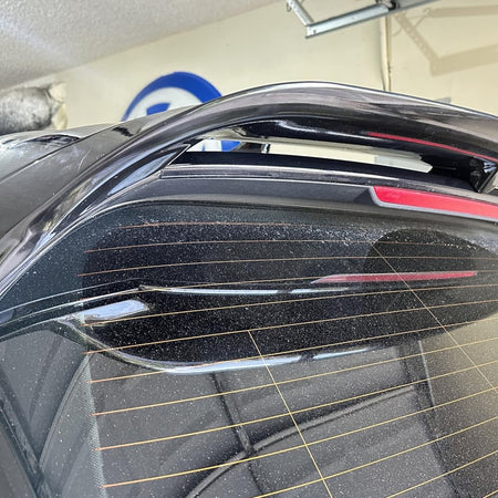 Golf 8 GTI gloss black ABS rear roof spoiler installed close up
