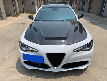 Alfa Romeo Giulia 952 carbon fiber hood installed on white sedan